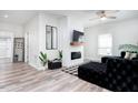 Bright living room with a modern fireplace, stylish furnishings, and lots of natural light at 323 W 5Th St, Burlington, NC 27215