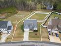 Aerial view of home with property lines, showcasing the large backyard at 358 Ashpole Trl, Clayton, NC 27520