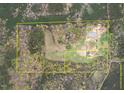 Aerial view showcasing approximate lot lines of vast land with pastures and woodland at 3880 L Lawrence Trl, Graham, NC 27253