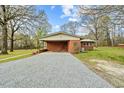 Home with a large covered carport and a well-kept gravel driveway at 4018 Moon Lindley Rd, Snow Camp, NC 27349