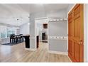 Open entryway showcasing the spacious layout, wood floors, and access to the kitchen and dining areas at 413 Correy Pl, Clayton, NC 27520