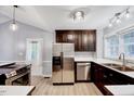 Modern kitchen featuring stainless steel appliances, sleek countertops, and stylish cabinetry at 413 Correy Pl, Clayton, NC 27520