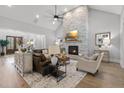 Cozy living room features a stone fireplace, hardwood floors, and comfortable seating at 482 Emily Ln, Chapel Hill, NC 27516