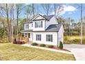 A lovely two-story home with a well-maintained lawn and landscaping at 62 Narmada Ct, Zebulon, NC 27597