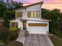 Beautiful two-story home with a modern design, striking windows, and a well-manicured lawn at 915 S State St, Raleigh, NC 27601
