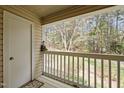 Enjoy outdoor views from the private balcony overlooking a lush, wooded area at 120 Schultz St, Chapel Hill, NC 27514
