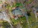 Aerial view of landscaped yard and home with curved driveway at 1302 Hermitage Rd, Sanford, NC 27330