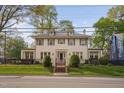 Beautiful home with wrought iron fence, manicured lawn, and charming curb appeal at 1403 Wake Forest Rd, Raleigh, NC 27604