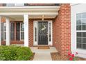 Inviting front entrance with a decorative wreath and a 'welcome home' doormat at 1607 Willowcrest Rd, Durham, NC 27703