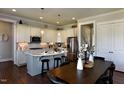 Modern kitchen with a center island, stainless steel appliances, and a dining area perfect for Gathering gatherings at 263 Gilliland Rd, Siler City, NC 27344