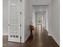 Bright entryway features hardwood floors, white trim, and a view into the home's living spaces at 3020 Mavisbank Cir, Apex, NC 27502