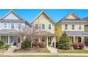 Inviting two-story home with a covered front porch, lush landscaping, and a friendly neighborhood setting at 45 Summersweet Ln, Chapel Hill, NC 27516
