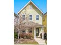 Attractive two-story home showcasing light green siding, a front porch, and neat landscaping at 45 Summersweet Ln, Chapel Hill, NC 27516