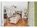 Bright living room boasts hardwood floors and a seamless transition to the dining area, perfect for entertaining at 45 Summersweet Ln, Chapel Hill, NC 27516