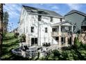 Beautiful backyard featuring a stone patio, fire pit, and covered deck, perfect for outdoor living at 565 Freedom Trail Dr, Willow Springs, NC 27592