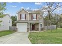 Charming two-story home featuring a well-manicured lawn and an attached single-car garage at 707 Obsidian Way, Durham, NC 27703