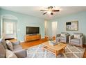 Cozy living room features neutral tones, comfortable seating, and hardwood floors, creating a relaxing atmosphere at 830 Finnbar Dr, Cary, NC 27519