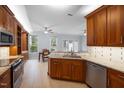 Spacious kitchen with granite countertops, custom cabinets, and stainless steel appliances at 11011 Southwalk Ln, Raleigh, NC 27614