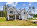 Charming two-story home featuring a two-car garage and landscaped front yard at 111 Artic Circle, Garner, NC 27529
