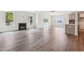 Bright living room with fireplace, hardwood floors, and natural light at 111 Artic Circle, Garner, NC 27529