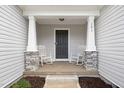 Inviting front porch with rocking chairs, perfect for relaxing outdoors at 121 Viajar Way, Smithfield, NC 27577