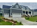 Beautiful home featuring two-car garage, well maintained lawn, and an inviting covered porch at 1221 Azalea Garden Cir, Raleigh, NC 27603