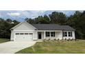 Charming single-story home with a gray exterior, attached garage, and well-manicured front lawn at 170 Eason Creek Way, Clayton, NC 27527