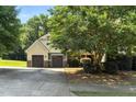 Charming two-story home featuring a two-car garage and a beautifully landscaped front yard at 181 Fawn Hill Ct, Garner, NC 27529