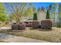 Charming two-story home featuring a well-manicured lawn, mature tree, and inviting curb appeal with a two car garage at 181 Fawn Hill Ct, Garner, NC 27529