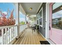 Inviting covered front porch with seating, perfect for enjoying the outdoors at 221 Douglas Falls Dr, Wendell, NC 27591