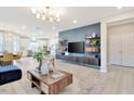 Spacious living room featuring modern decor, a large TV, and an open floor plan at 2265 Kettle Falls Sta, Apex, NC 27502