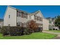 This home features a well maintained lawn, side driveway, and neutral colored siding at 2321 Stony Bottom Dr, Raleigh, NC 27610