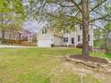Beautifully landscaped front yard complements this inviting home with a two-car garage and a basketball hoop at 3705 Andoversford Ct, Wake Forest, NC 27587
