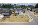 Aerial view of the home showcasing landscaping and neighborhood at 401 Club Center Dr, Youngsville, NC 27596
