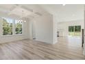 Bright living room with an open floor plan and access to the outdoor deck and kitchen at 426 Adams Pointe Ct, Angier, NC 27501
