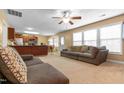 Open-concept living area with natural light, seamless flow to kitchen, and comfortable seating arrangement at 43 Summerseat Way, Bunnlevel, NC 28323