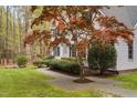 Charming home showcases a beautiful Japanese Maple and lush green lawn at 537 Chatham Dr, Chapel Hill, NC 27516