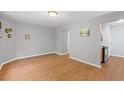 Open living room featuring hardwood floors and neutral gray walls at 708 Brye St, Durham, NC 27703