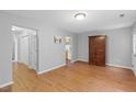 Spacious living room featuring wood floors and neutral gray walls at 708 Brye St, Durham, NC 27703