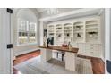 Bright office with custom built-ins, a modern desk, and a large window at 76501 Rice, Chapel Hill, NC 27517