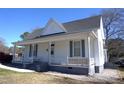 Traditional home exterior with a welcoming front porch, featuring classic architecture and a cozy feel at 10095 N Walnut St St, Middlesex, NC 27557