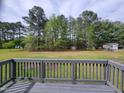 View from the backyard deck, featuring a large backyard and storage shed at 1033 Silas Moore Rd, Benson, NC 27504