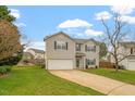 Two-story home with green shutters and a well-manicured front yard on a sunny day at 109 Wyeth Meadows Ln, Holly Springs, NC 27540