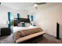 A spacious main bedroom features a ceiling fan, carpet, and large window at 111 Flying Point Ln, Clayton, NC 27520