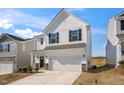 Charming two-story home with white siding, black shutters, and a spacious two-car garage at 196 River Bank Rd, Fuquay Varina, NC 27526