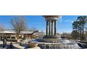 Ornate tiered water fountain sits in a landscaped setting near an outdoor cafe at 213 Lord Byron Ct, Cary, NC 27513