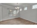 Bright dining area with hardwood floors, crown molding, and natural light at 233 Stone River Dr, Wendell, NC 27591
