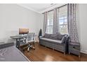 Cozy office space featuring hardwood floors, gray walls, and a comfortable seating arrangement at 270 Trailing Bluff Way, Garner, NC 27529