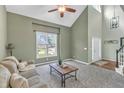 Bright living room with large windows, high ceilings, and comfortable seating at 2832 Steeple Run Dr, Wake Forest, NC 27587