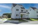 Attractive exterior view of a light blue two-story house with well-kept landscaping, situated on a corner lot at 430 Wyndham Dr, Chapel Hill, NC 27516